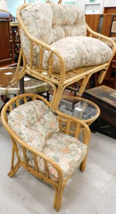 A three piece patio suite, comprising two seater settee, armchair, table, and a wooden breakfast...