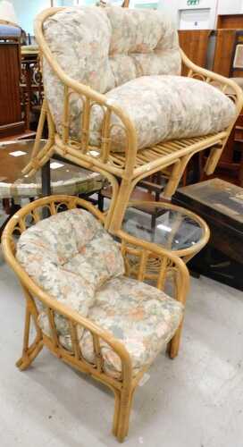 A three piece patio suite, comprising two seater settee, armchair, table, and a wooden breakfast...