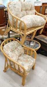 A three piece patio suite, comprising two seater settee, armchair, table, and a wooden breakfast...