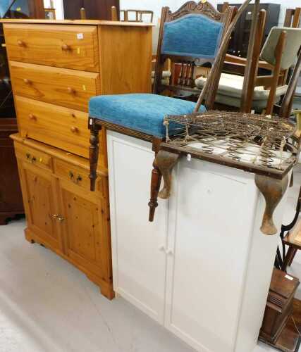 A pine finished three drawer chest, a further pine sideboard, heavily carved chair, part chair...