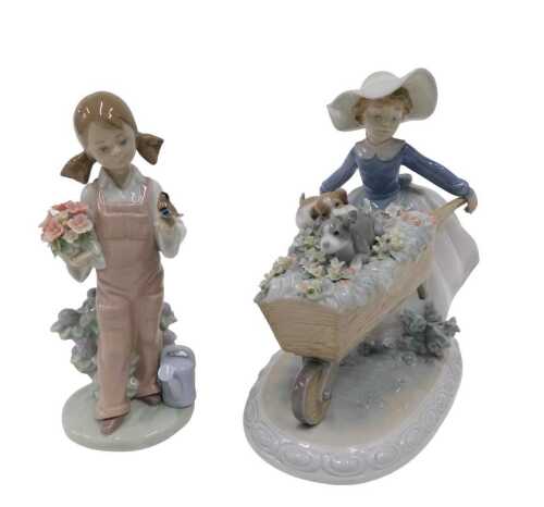 A Lladro figure, Barrel of Fun, model 5460, 19cm high, and a further Lladro figure. (2)