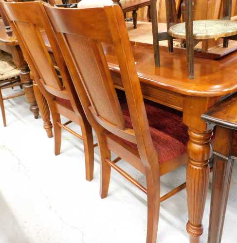 A dining room suite, comprising oblong extending table, and four chairs.