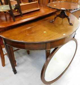 A mahogany finish Georgian style tripod table top stand, with piecrust edge, demilune table and...