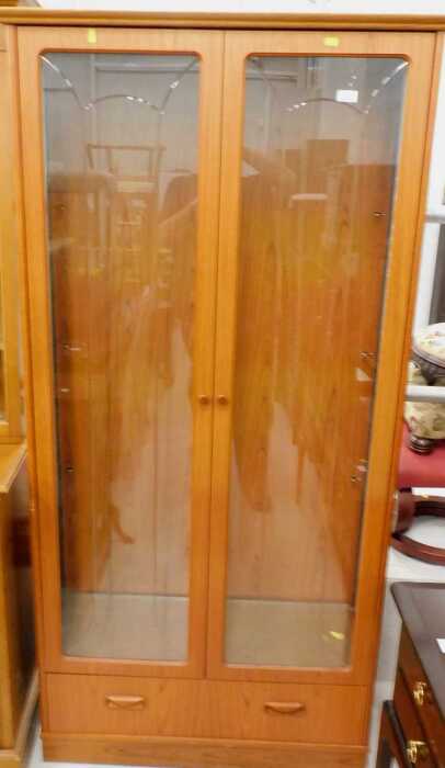 A G-plan teak freestanding cabinet, of rectangular form with drawer beneath, 81cm high, 86cm...