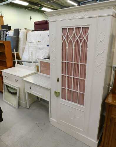 A bedroom trio, comprising elaborate single door wardrobe, marble finished topped wash stand,...