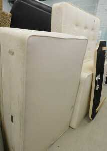 A 58" wide part floral mattress, with divan style base and headboard.