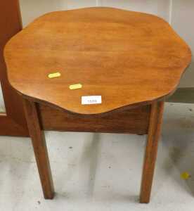 An oak sewing box, with shaped floral top.