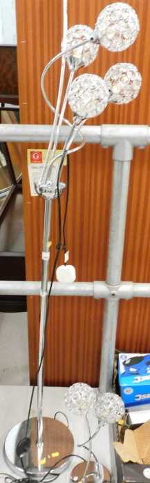 A modern chrome finish standard lamp, and matching table lamp with orb top.