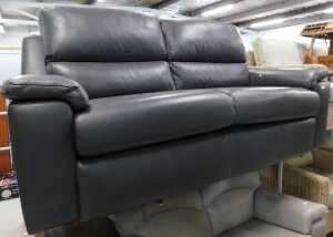 A three seater settee, in grey leather.