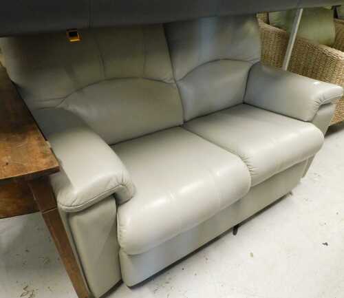 A two seater settee, in cream leather.