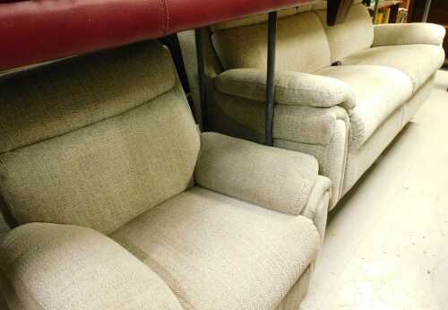 A two piece lounge suite, comprising two seater settee and an armchair, in oatmeal coloured...