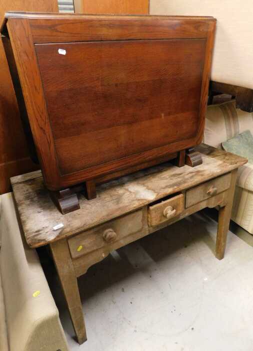 A late 19thC rustic pine side table, with three drawers, on square tapering legs, and an oak...