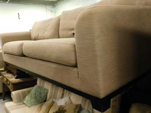 A large two seater lounge settee, in grey material.