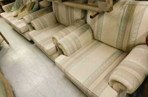 A three piece lounge suite, comprising three seater settee and two armchairs, in Regency style...