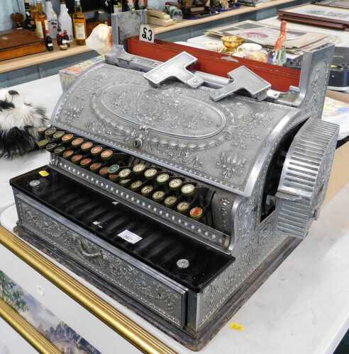 A vintage National Cash Register till, of highly elaborate form, with articulated numbering in...