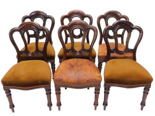 A set of six Victorian mahogany balloon back dining chairs, with shaped pierced backs, raised...