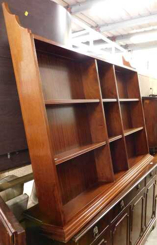 A set of mahogany hanging wall shelves.