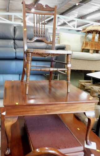 An early 20thC carved walnut low occasional chair, with carved cresting rail, and an Edwardian...