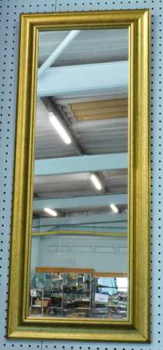 A rectangular hanging mirror.