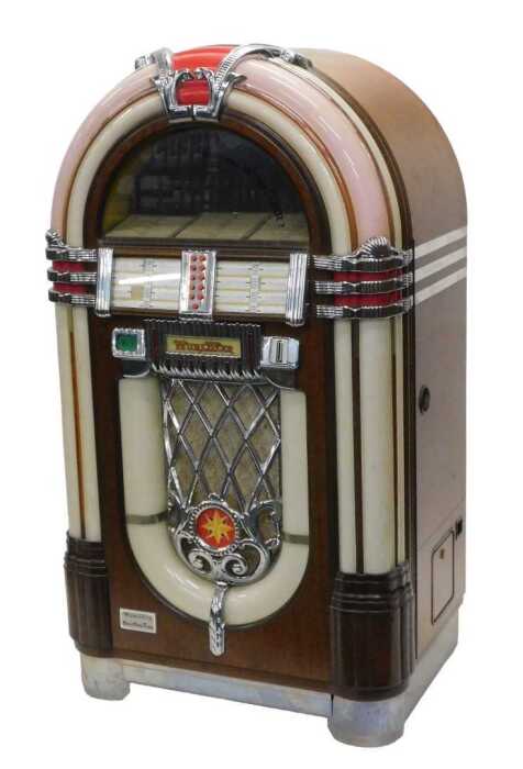 A Wurlitzer MB20/16 juke box, numbered 29105317, in a domed veneered case with Art Deco car...