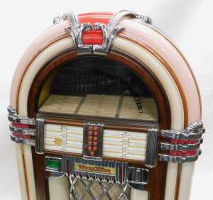 A Wurlitzer MB20/16 juke box, numbered 29105317, in a domed veneered case with Art Deco car... - 2