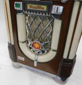 A Wurlitzer MB20/16 juke box, numbered 29105317, in a domed veneered case with Art Deco car... - 3