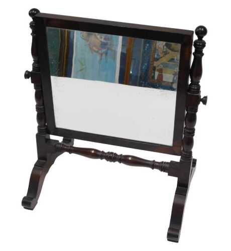 An early 20thC walnut table mirror, of small proportion, with a rectangular glass held on turned...