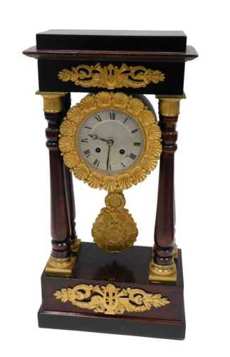 A 19thC ormolu mounted portico clock, the rectangular classical case centred by a 15cm wide...