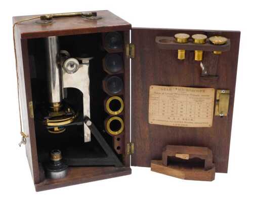 An early 20thC Star microscope, with brass stage, adjustable metal fittings, and triangular stem...