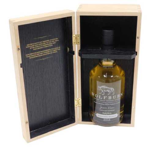 A bottle of Wolfburn single malt whisky, inaugural release 2016, in wooden case, 31cm high, with...