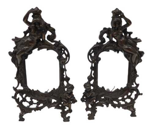 A pair of late 20thC Art Nouveau design photograph frames, each profusely decorated with figures...