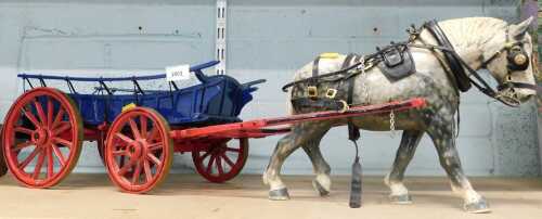 A ceramic model cart horse and hay wagon, horse tack, brasses, etc., 78cm long.