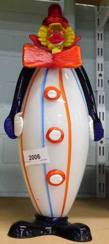 A Murano style glass clown, multicoloured with red bow tie and hat, 35cm high.