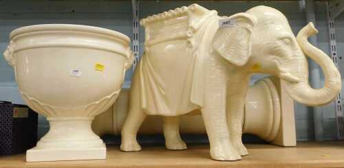 A white glazed ceramic planter, 30cm high, together with a matching pedestal stand, and resin...