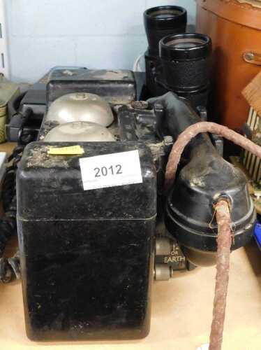 Various communication equipment, etc., a MC field style telephone in black Bakelite, with chord...