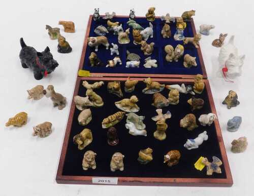 A quantity of Wade animal figurines, including dogs, cats, birds, etc., together with a pair of...