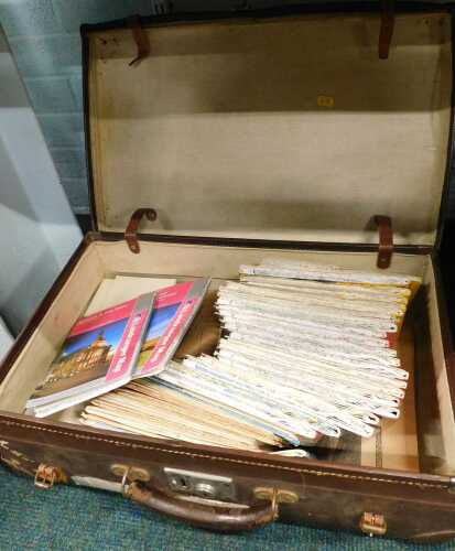 A brown leather travel case, and a quantity of OS maps.