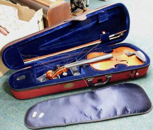 A Stentor child's or practice student's violin, No. II, with bow, in outer case with other...