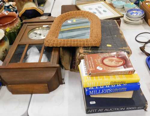 A 19thC large Family Bible, various other books, Millers guides, wicker style mirror, and an oak...