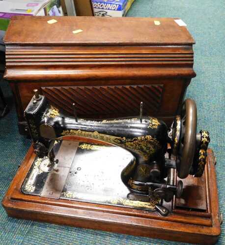 An early 20thC sewing machine.