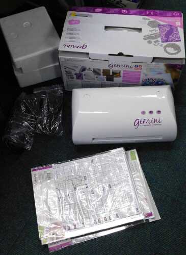 A Gemini Crafter's Companion multimedia machine, cuts, embosses and more.