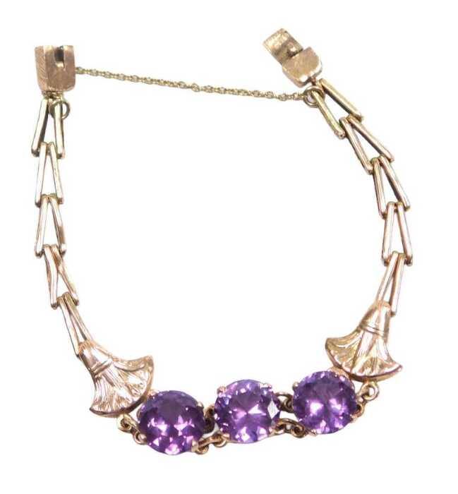 A mystic topaz bracelet, set with three round brilliant cut stones, each in a raised four claw...