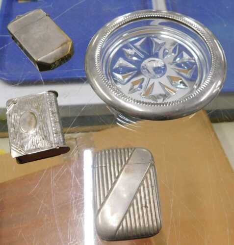 An early 20thC brass Vesta case, in the form of a book, together with two other plated Vestas,...