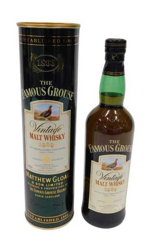 A bottle of Famous Grouse vintage malt whisky 1989, in outer tin tube.