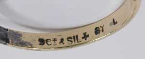 A single stone dress ring, set with large central imitation diamond in a raised claw basket... - 2