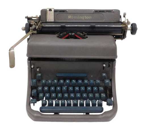 A vintage Remington typewriter in grey, with turquoise keys, with white lettering, 33cm wide.