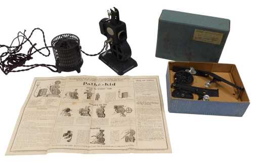 A Pathescope Kid tabletop projector, 24cm high, with attachment and other accessories.