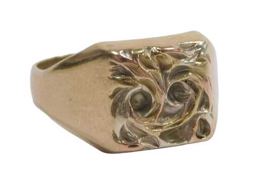 A signet ring, the twist design ring head in bicolour finish, on a yellow metal band, with...