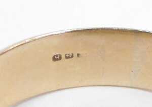 A signet ring, the twist design ring head in bicolour finish, on a yellow metal band, with... - 2