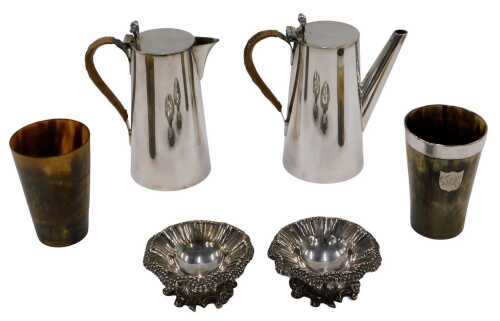 An early 20thC silver plated water jug and coffee pot, each with scroll handles of plain...